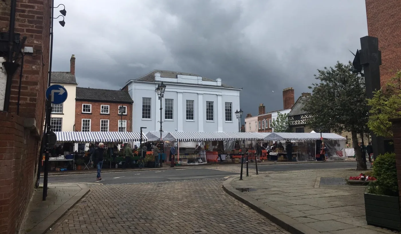 Ludlow's market on Castle Square on an ordinary spring market day, not one of the Christmas markets